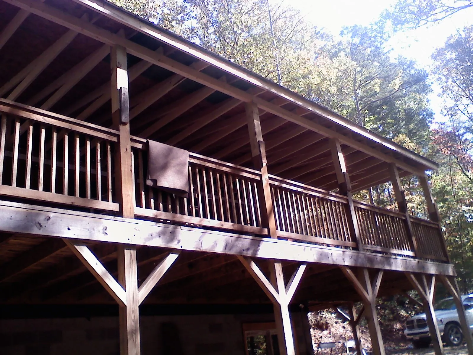 Timber framing under a new elevated porch and deck — Roof Leak Repair in Meservey by Roofing Brothers